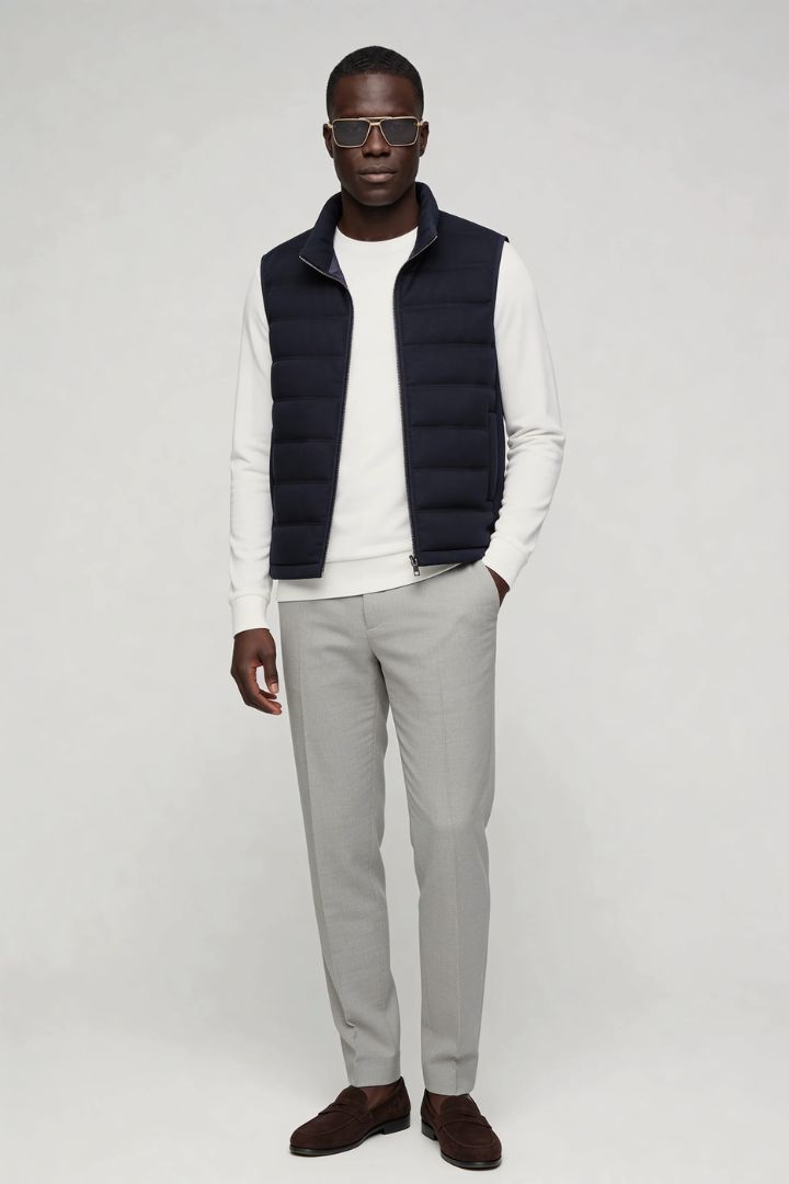 mens navy down puffer vest lightweight insulated gilet in full Lavencio outfit.