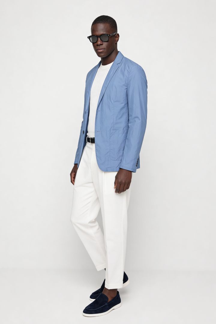 Man wearing lightweight light blue blazer jacket showing his full Lavencio outfit.