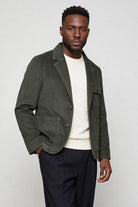 Men’s olive green corduroy blazer jacket with retro tailored fit side pose