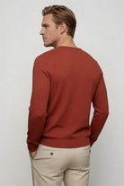Men’s red lightweight V-neck knit sweater with ribbed cuffs and clean slim silhouette back view