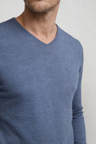 Men’s blue lightweight V-neck knit sweater with ribbed cuffs and clean slim silhouette close-up