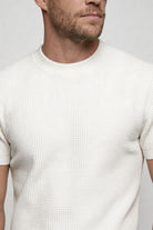 Lavencio Men’s slim fit textured cotton knit short sleeve t-shirt in cream white close up