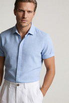 Men’s white pleated linen shorts in breathable lyocell linen blend with tailored summer fit outfit