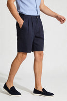 Men’s navy pleated linen shorts in breathable lyocell linen blend with tailored summer fit in motion