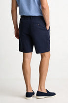 Men’s navy pleated linen shorts in breathable lyocell linen blend with tailored summer fit back view