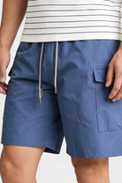 Men’s blue utility cargo shorts with drawstring waist and side cargo pockets in lightweight fabric close-up