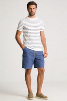 Lavencio Men’s blue utility cargo shorts with drawstring waist and side cargo pockets in lightweight fabric model shoot