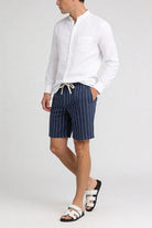 Men’s navy linen stripe shorts with drawstring waist and relaxed breathable summer fit model shoot