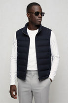 mens navy down puffer vest lightweight insulated gilet posing