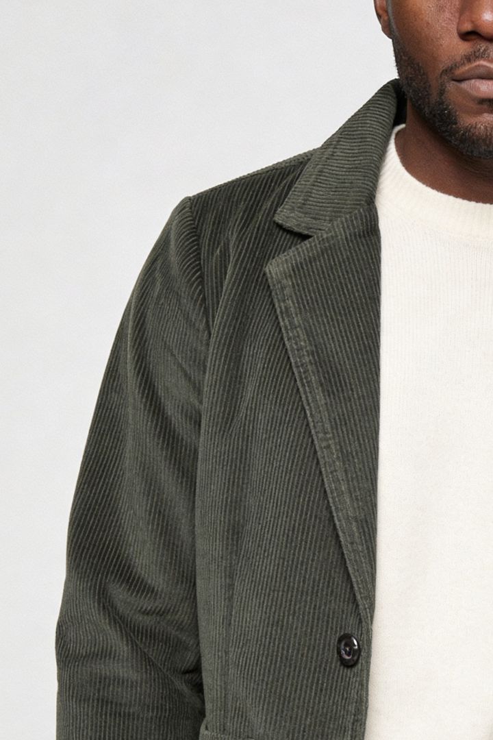 Men’s olive green corduroy blazer jacket with retro tailored fit close-up detail